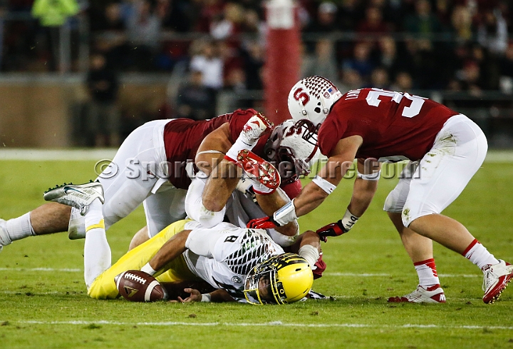 2013-Stanford-Oregon-051.JPG - Nov. 7, 2013; Stanford, CA, USA; Oregon Ducks quarterback Marcus Mariota (8) fumbles against Stanford Cardinal at Stanford Stadium. Stanford defeated Oregon 26-20.