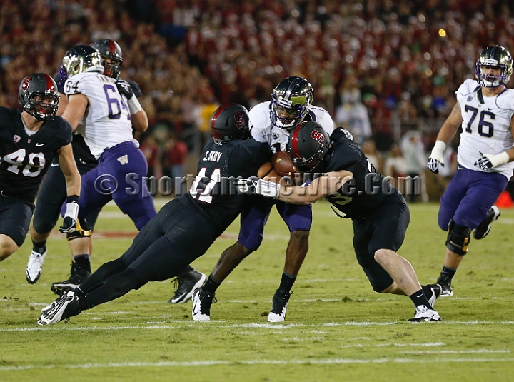 2013Stanford-Wash-059.JPG - Oct. 5, 2013; Stanford, CA, USA; Washington Huskies quarterback Kevin Price (17) is tackled by Stanford Cardinal linebackers Shayne Skov (11) and Blake Lueders (43) at  Stanford Stadium. Stanford defeated Washington 31-28.