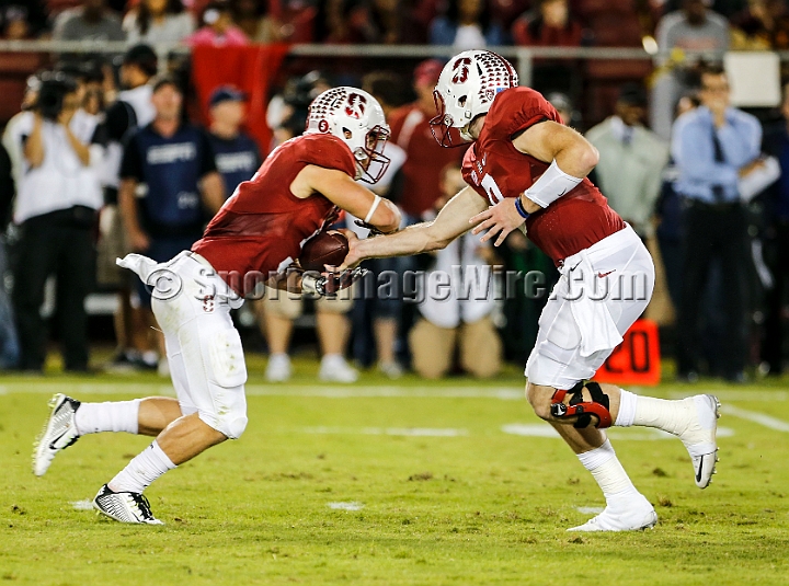 2015StanWash-042.JPG - Oct 24, 2015; Stanford, CA, USA; Stanford Cardinal quarterback Kevin Hogan (8) hands of to running back Christian McCaffrey (5) in the first quarter against the Washington Huskies at Stanford Stadium. Stanford beat Washington 31-14.