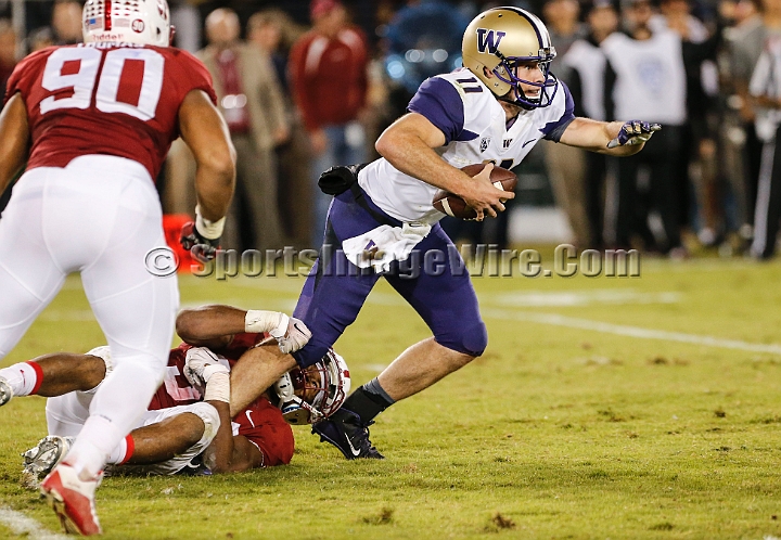2015StanWash-062.JPG - Oct 24, 2015; Stanford, CA, USA; Washington Huskies quarterback K. J. Carta-Samuels (11) is sacked by Stanford Cardinal linebacker Peter Kalambayi (34) in the third quarter at Stanford Stadium. Stanford beat Washington 31-14.